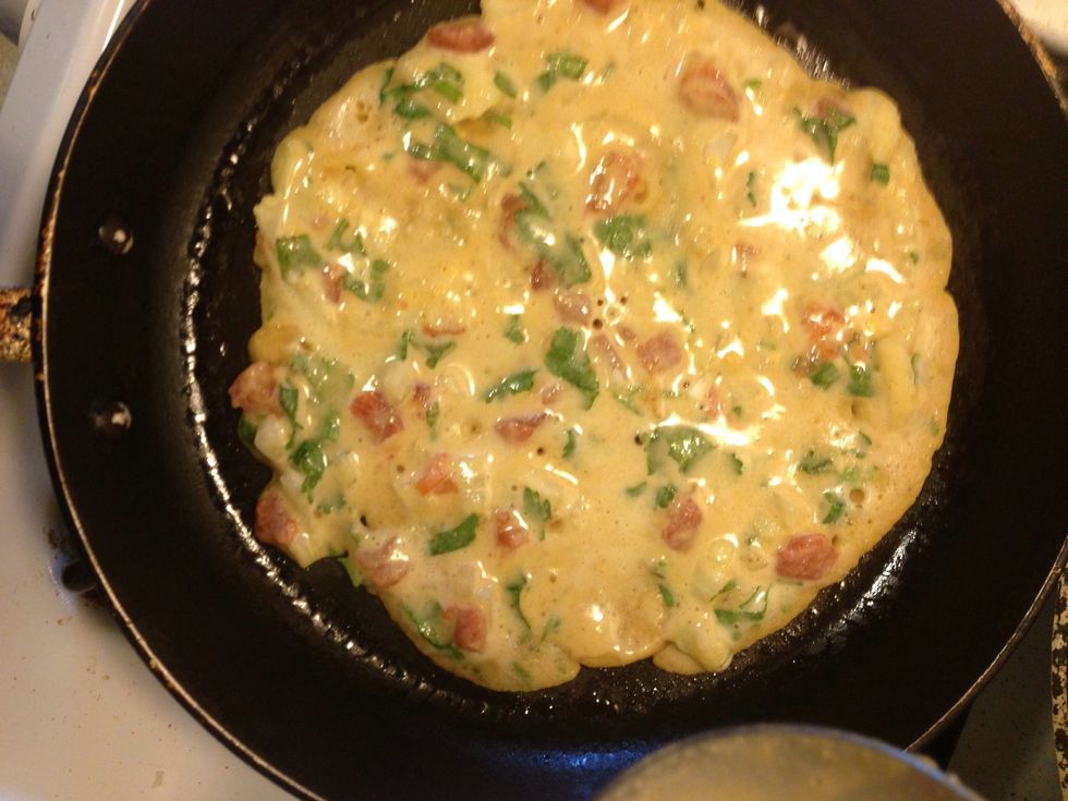 ...and spread evenly. Cover and cook on medium flame for about 3-4 mins.