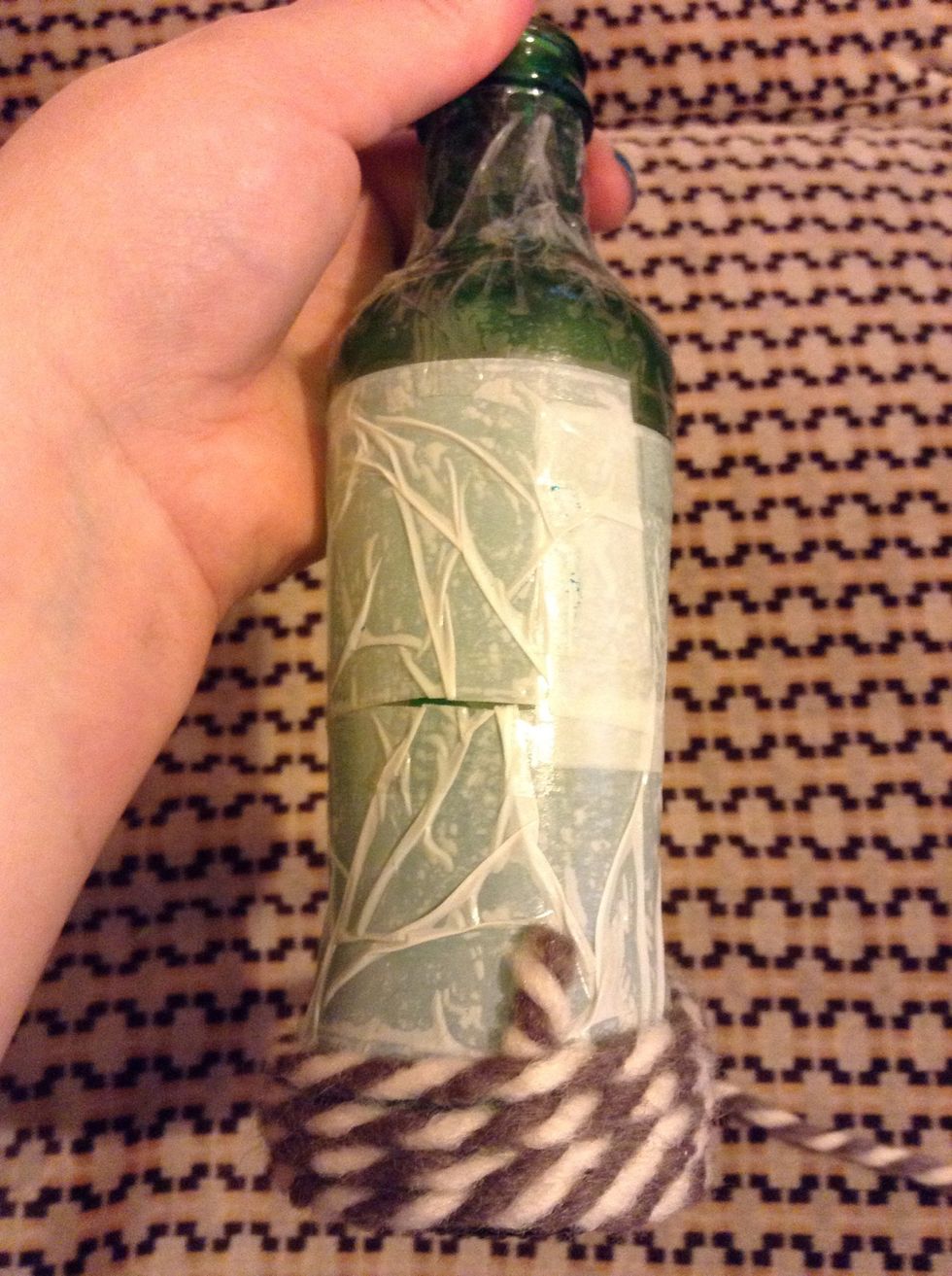 And start rolling it tightly around the bottle.