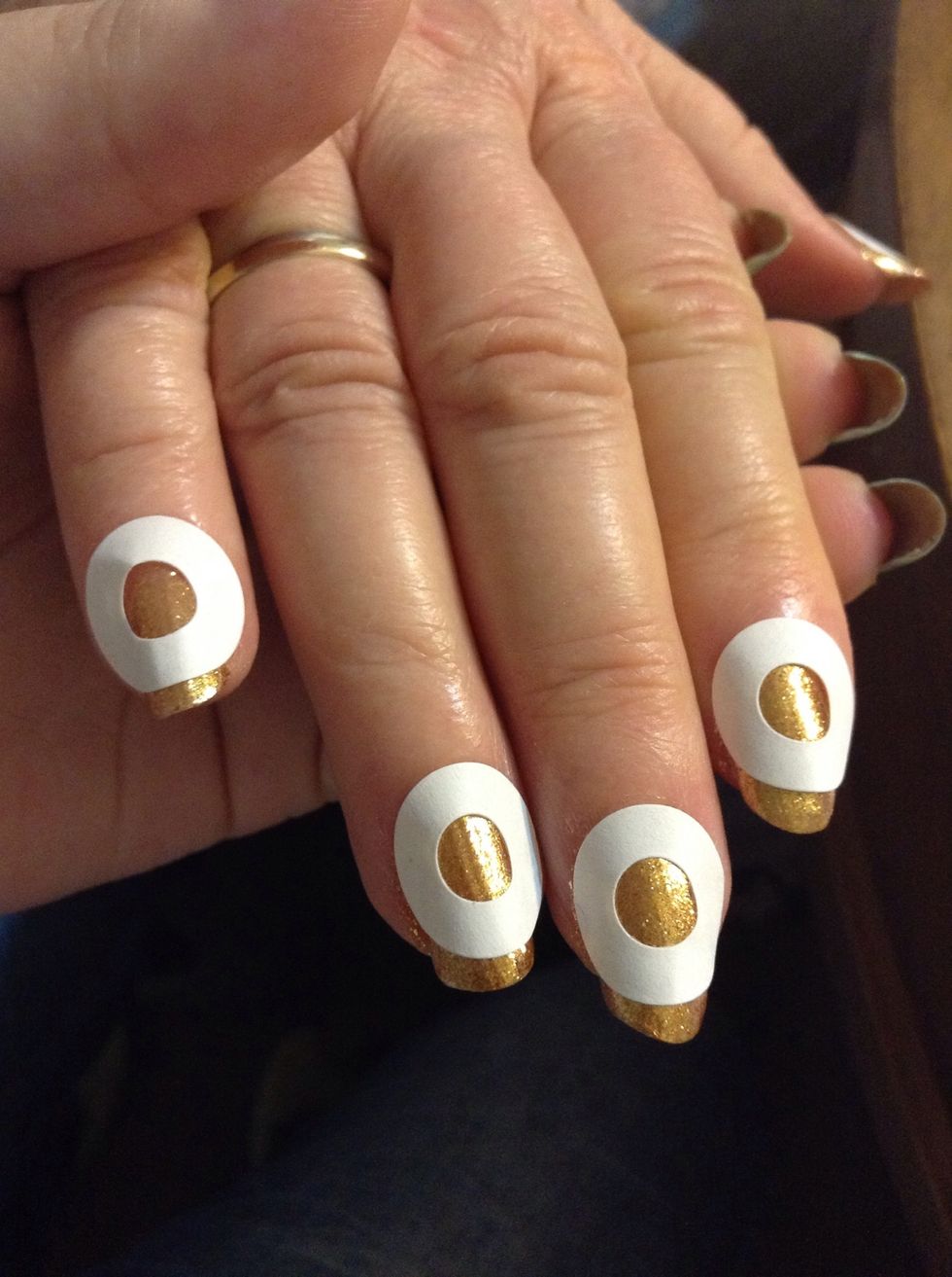 And stick them on like this. Make sure your nails are completely dry, or the sticker will pull up the polish. You can make the tip as wide or narrow as you like.