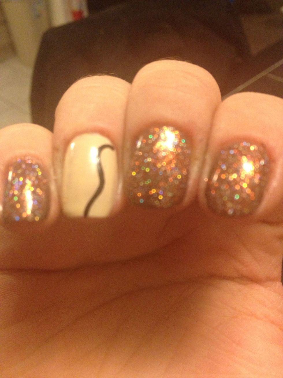 And swipe down the nail with a small curve. This connects the head and the neck