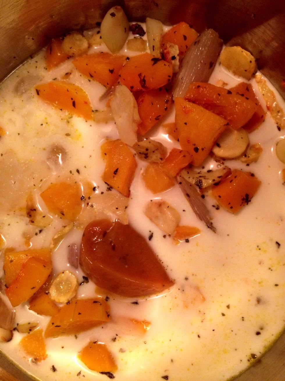..and the chicken broth. Also add the water. Use your hand mixer to blend the veggies carefully.