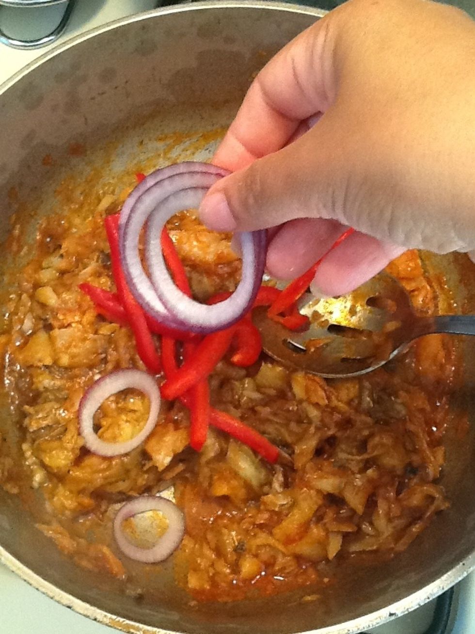 And the onions. Stir it in . The onions and peppers will be cooked by the heat of the food. Plus I like the onion and peppers to be somewhat firm and not overcooked.