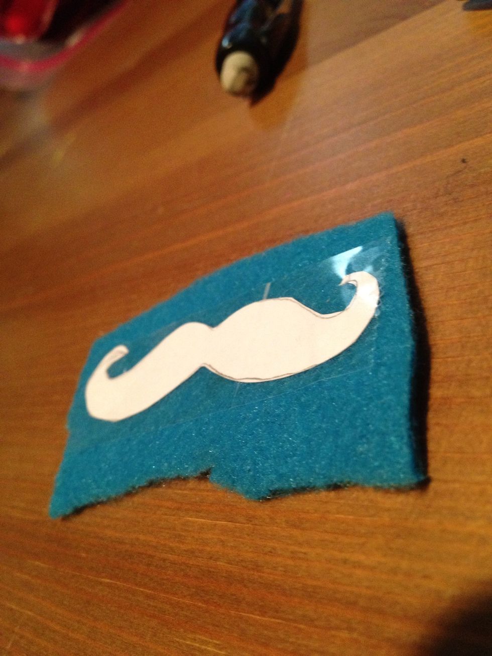 And the secret tool is tape! Put some tape to make your pattern stay. It doesn't have to cover the whole thing but just enough do it doesn't move around while you cut:)