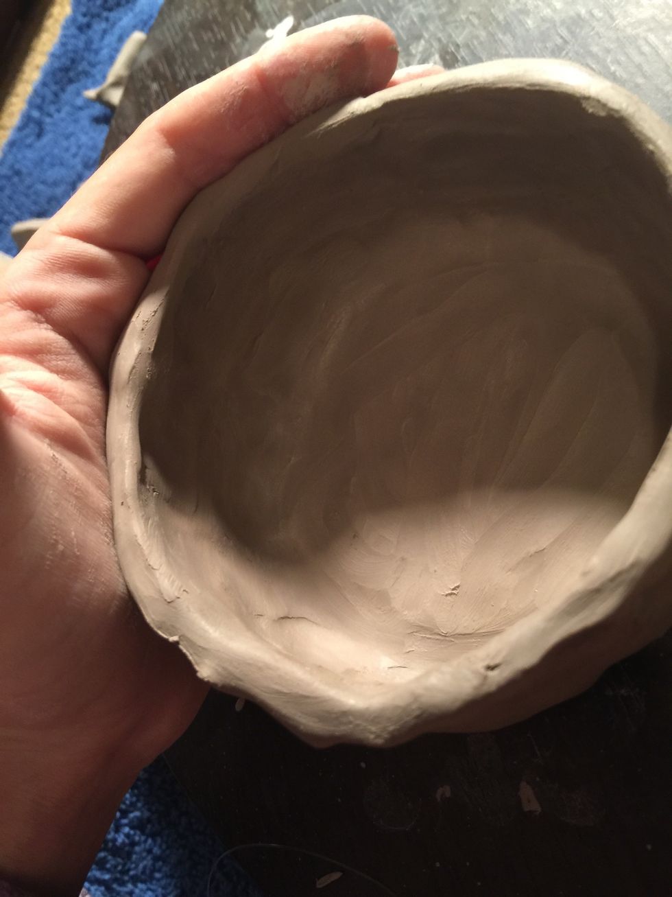 And the sides of your pot. But make sure you put your other hand on the outside so that the wall doesn't collapse so lose its shape.