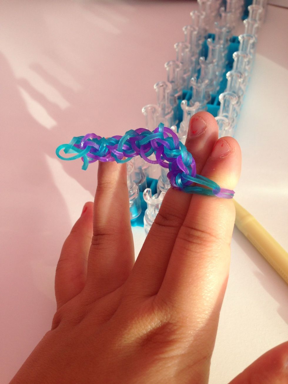 And the take the end and put it in between your fingers.