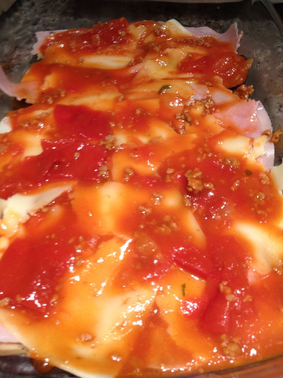 And the Tomato sauce. Repeat until the tray is filled.