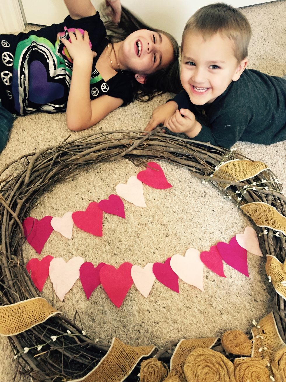 And then I recruited another helper. Lay the hearts to figure the length and that you have enough for your wreath size.