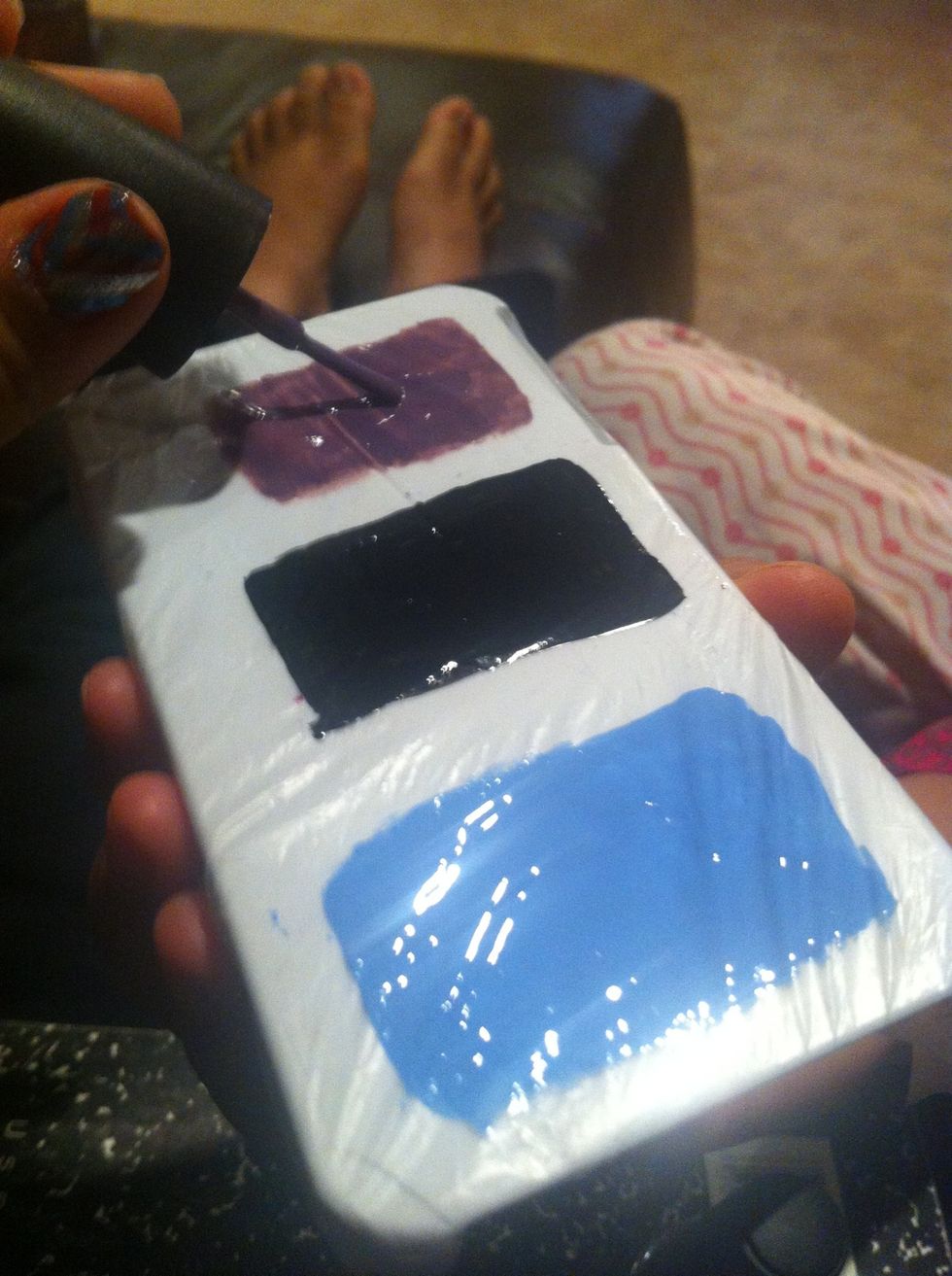 And then paint three rectangles of the colors onto your plastic. I taped a piece of a plastic bag onto an iPhone case. But thats just me(:
