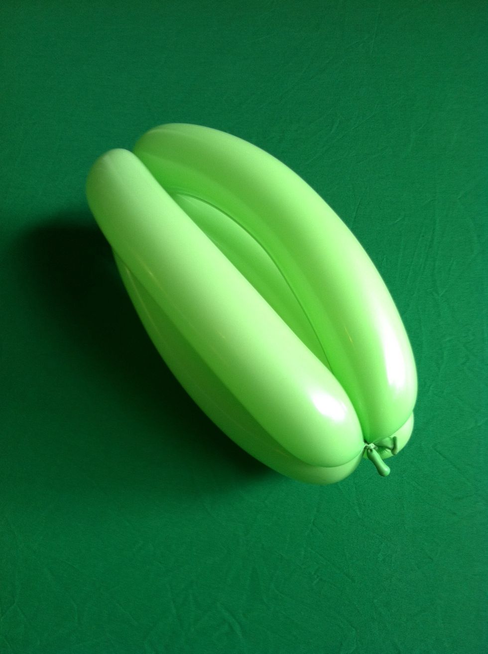 And then tie one end to the other.  Now you have a football twist or a banana twist