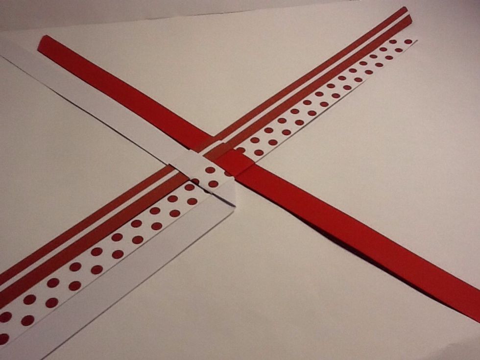 And tighten fold back the white strip so it makes a little triangle