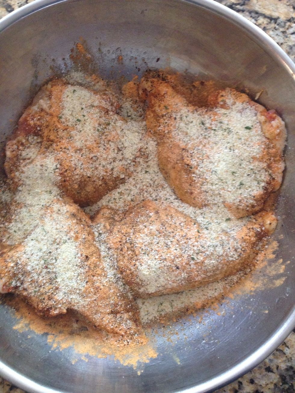 And tons of the garlic salt. Once all this is done I shake off the excess and pat all over chicken sides. Making a rub from the oil and spices