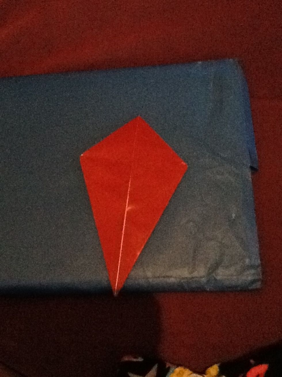 And turn it over and fold and crease the other flaps again.