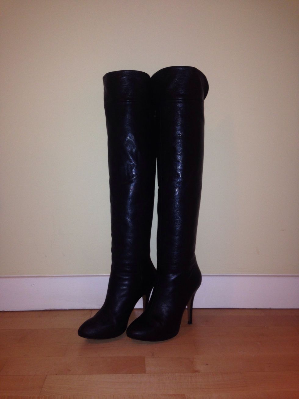 And voila! Your boots are now free/standing and independent, retaining their natural shape and style. You've also found a smart place to store your plastic bags!