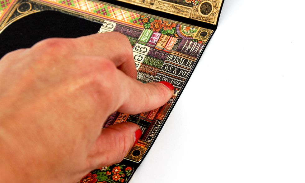 and we make sure that the lower cut of our folding is parallel to the edge of the postcard and doesn\u2019t go out of its borders.