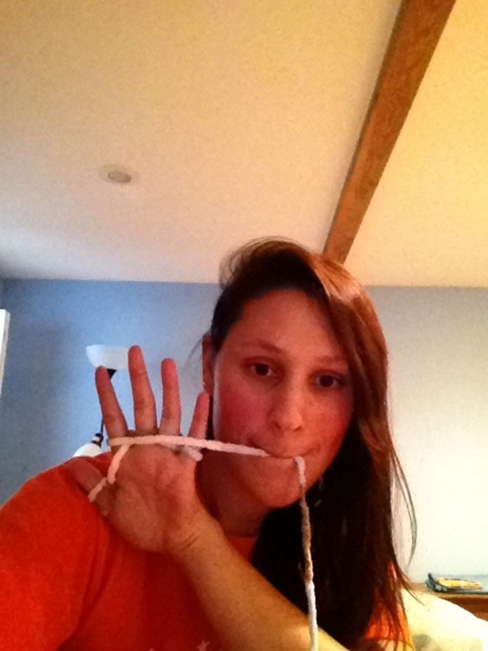 ...and wrap the yarn back around the palm side of your hand, so it looks like this.