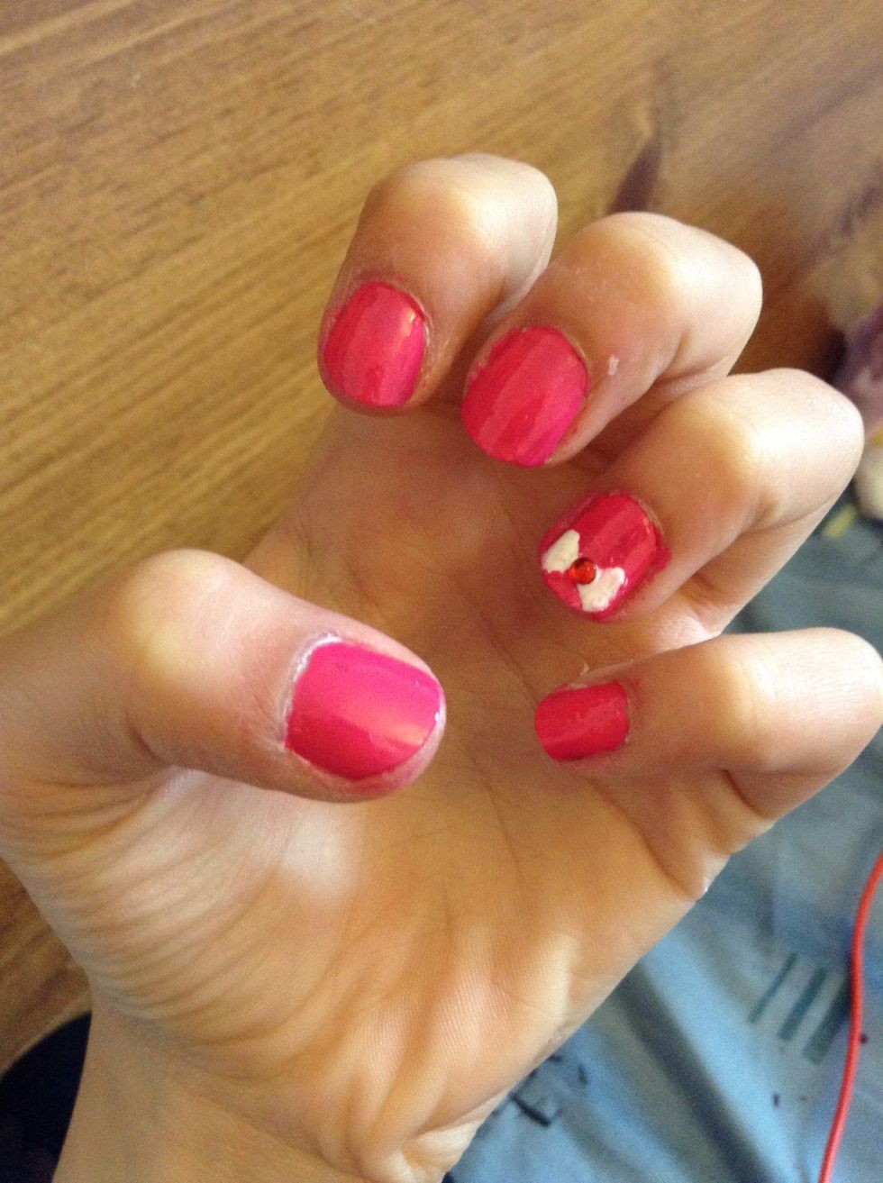 And you're done if you want add a gem in the middle like I did you can.And don't forget your edges with Nail polish remover and a Q-tip