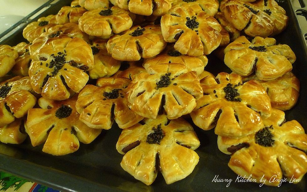 And you're done! The dainty, golden brown plum blossom mooncakes are ready for packing in airtight containers.