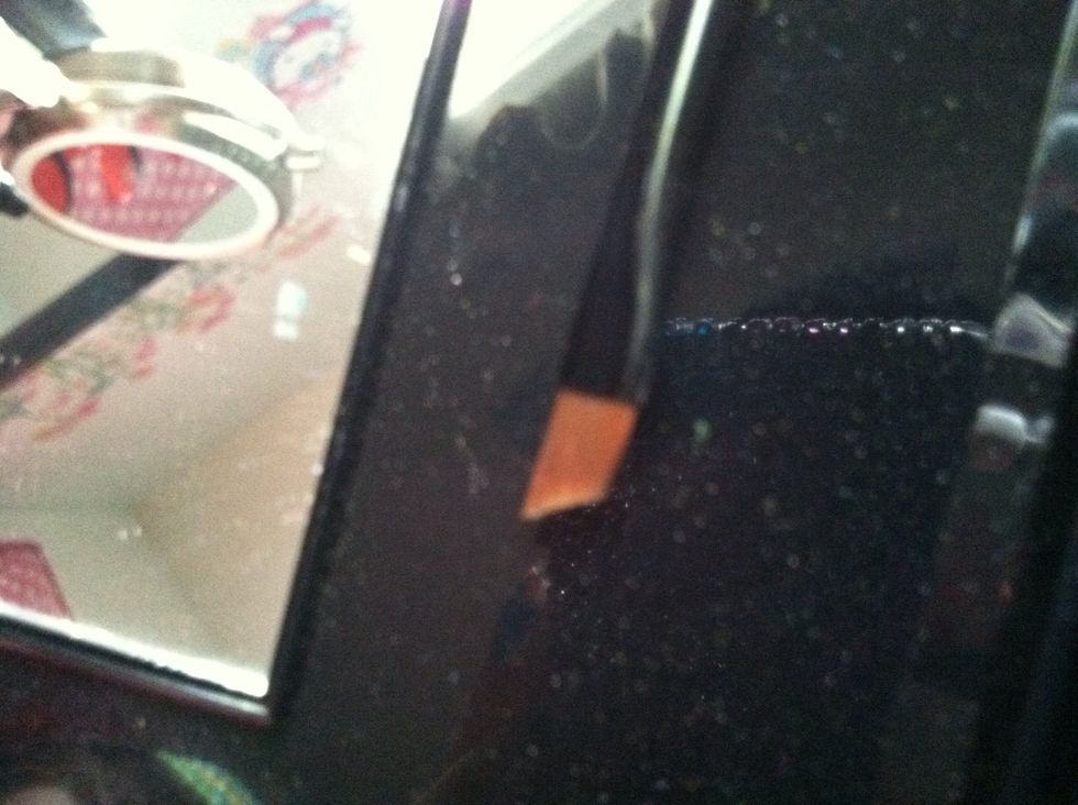 Angled eye liner brush.