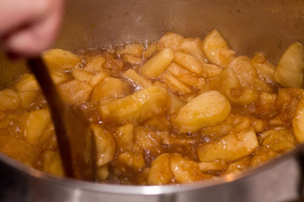 Another 5 minutes and the sauce is getting thick. The apples are starting to break up too.