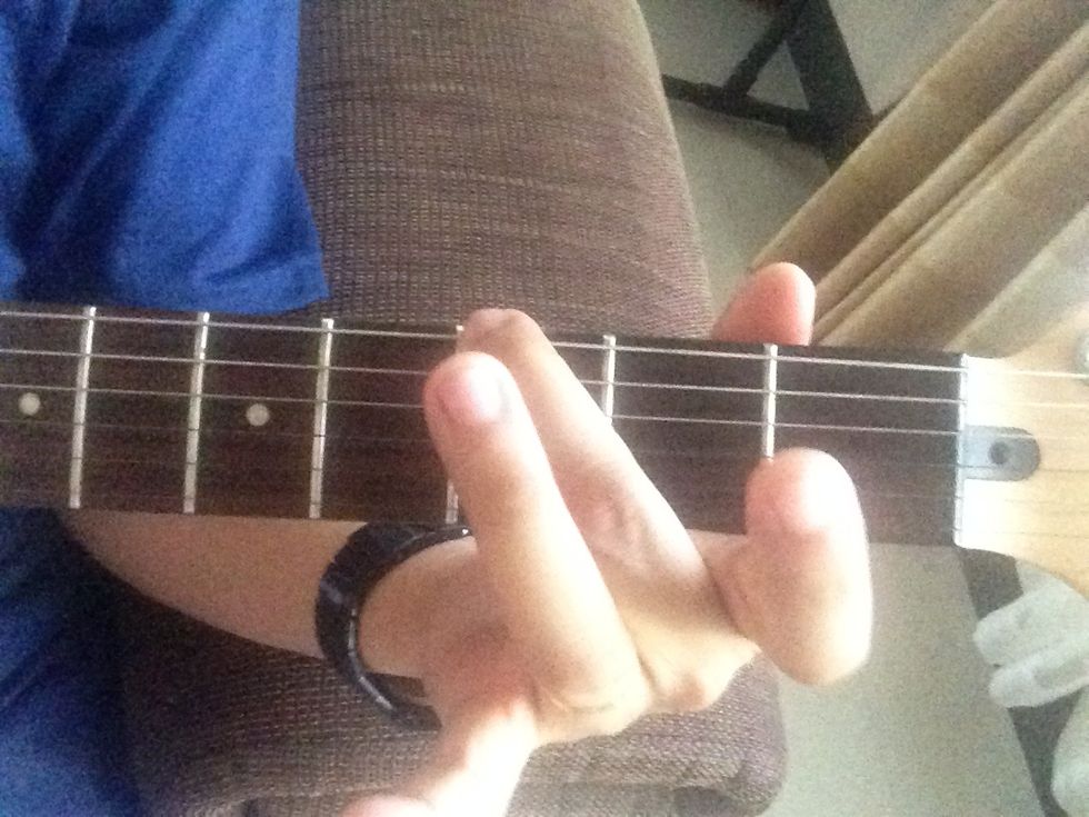 Another form of G major is called an open G. This is simpler because there is no bar finger. Put your middle finger on 3rd fret of the thickest string.