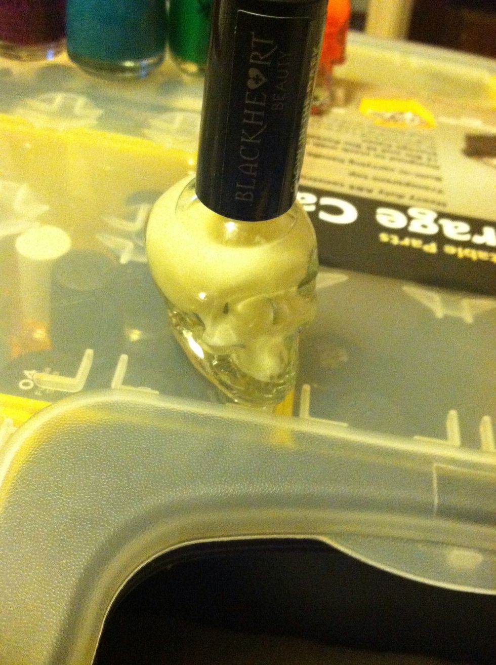 Another fun thing you can do is add a glow in the dark nail polish before doing the 2nd black line. The nail will glow but the lines won't. It looks pretty cool. It was bought from Hot Topic.