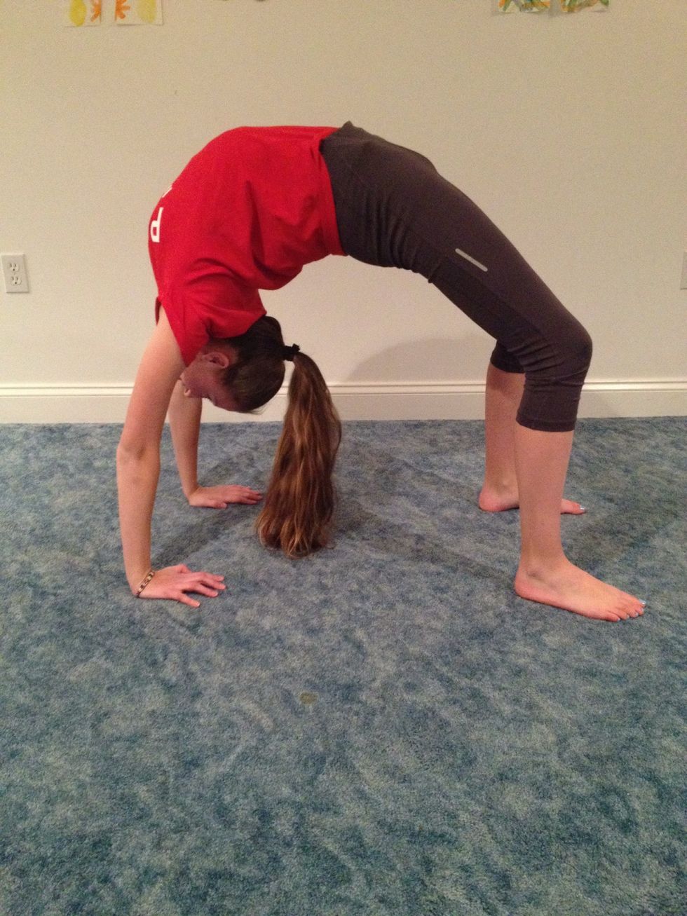 Another stretch is to do a bridge and walk your hands as closest to your feet.