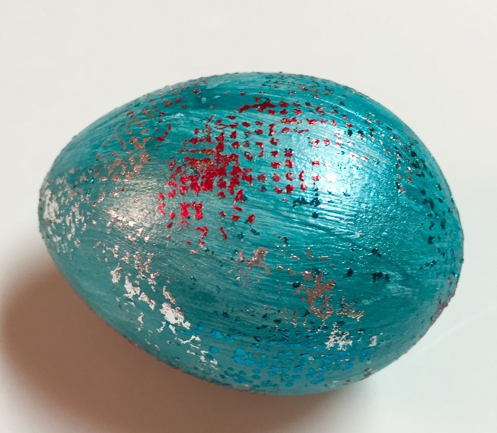 another way to foil egg, and to use up any leftover bits of adhesive and foil, is an all over random pattern. just rub bits of adhesive on egg and then rub with leftover foil.