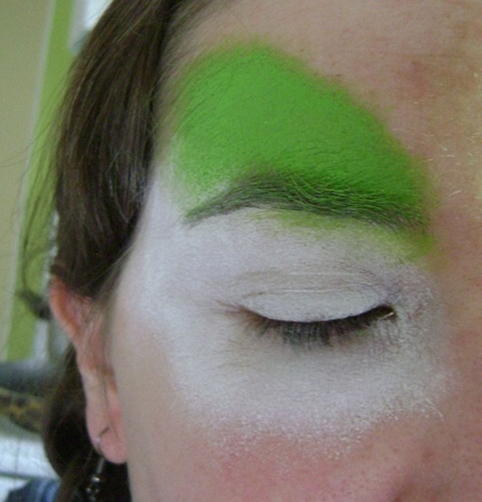 ANsponge the green color above your eyebrows.