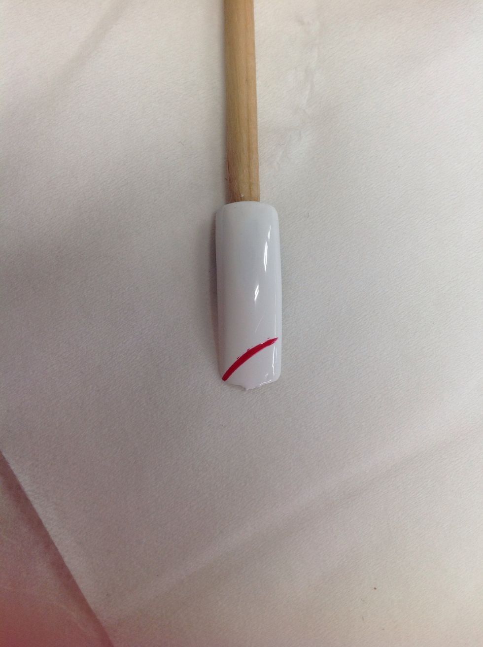 Applied one red stripe using the red nail stripper polish.