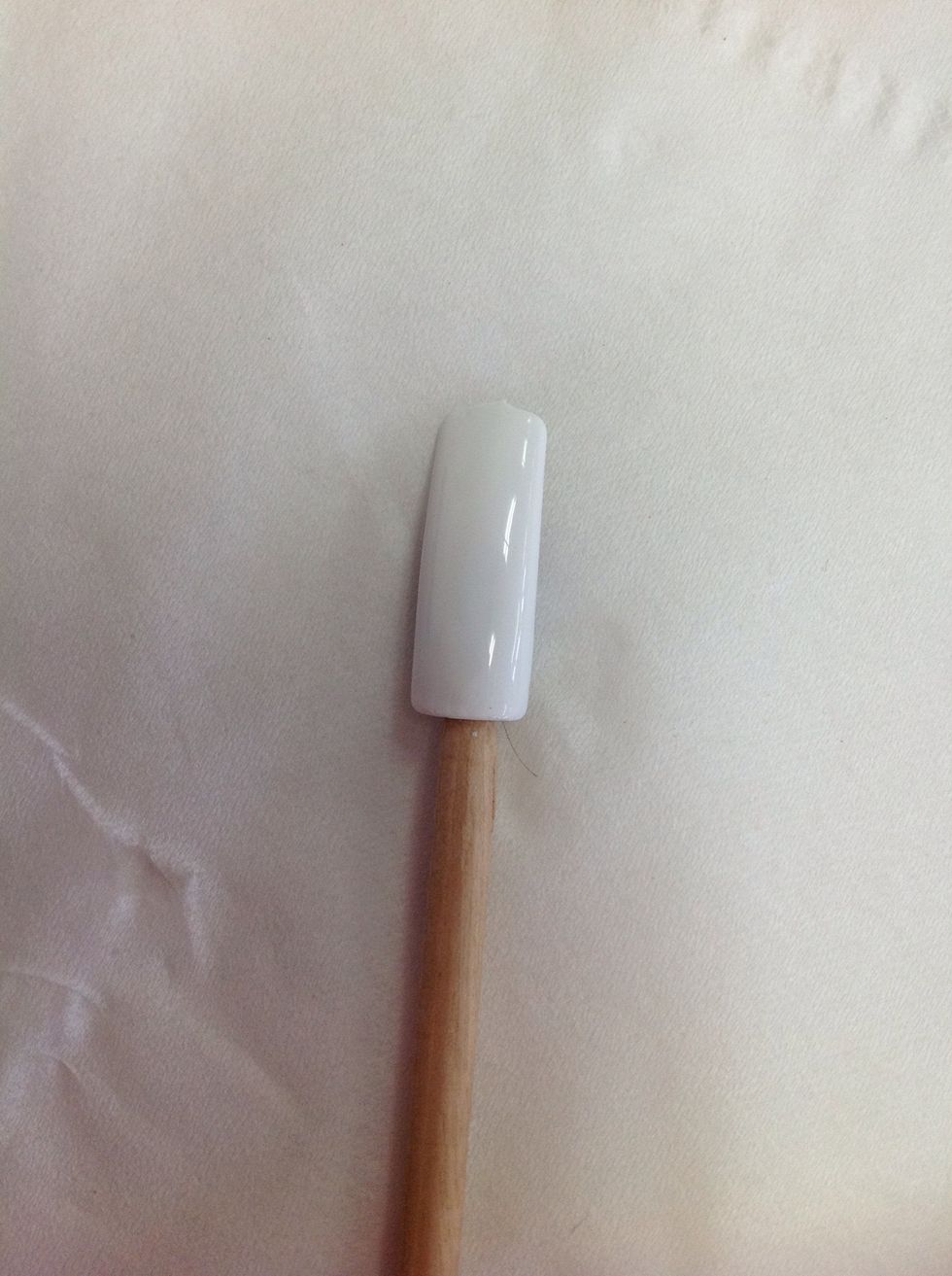 Applied two coats of OPI Alpine Snow nail polish.