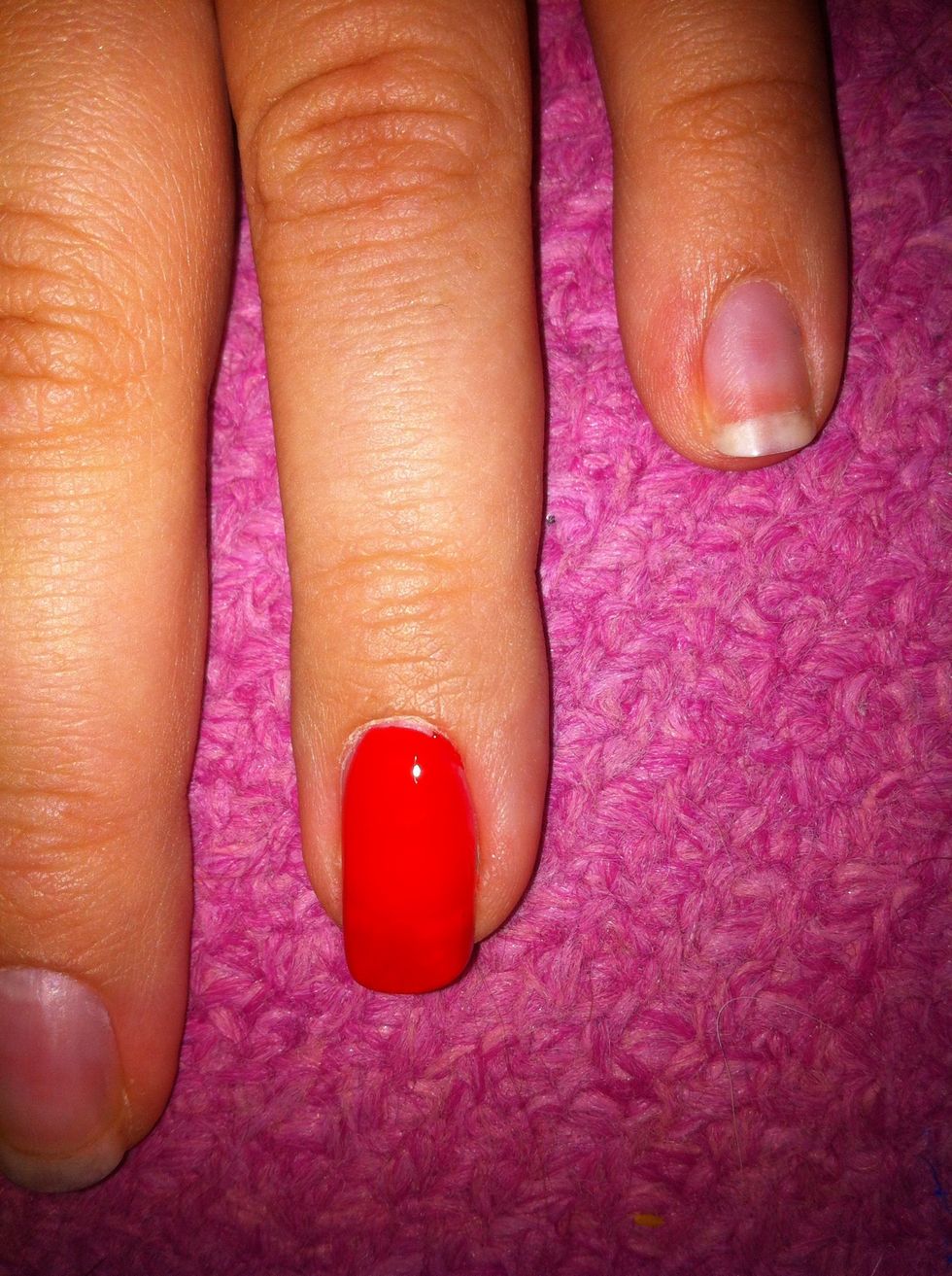 Apply 2 coats of chosen background colour. In this case red as stated in the supplies step. Please excuse the polish on my hands in this guide.