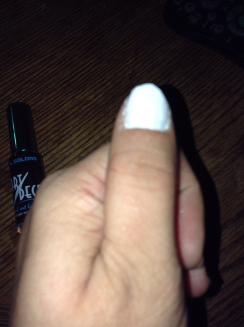 Apply 2 coats of white polish. Allow to dry completely.