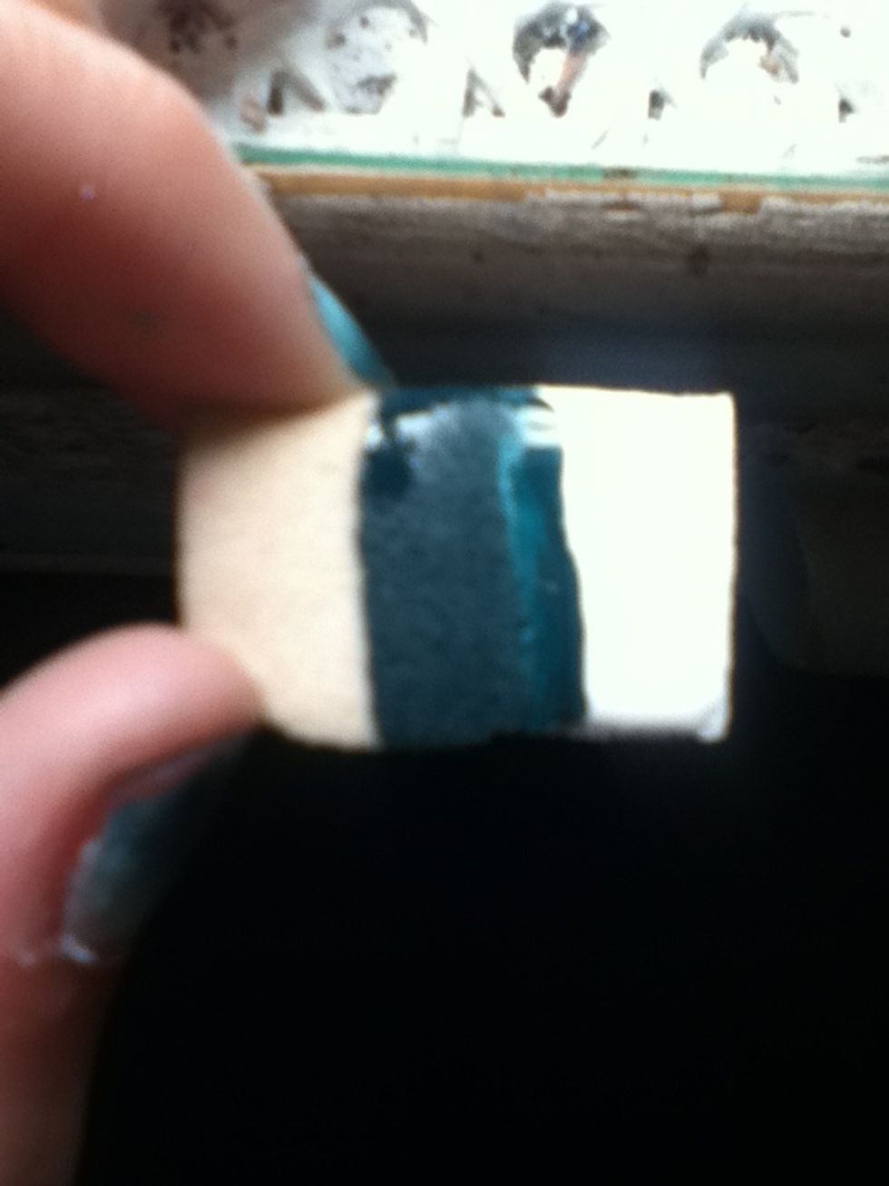 Apply 2+ colours to a makeup sponge. Im using white and green.