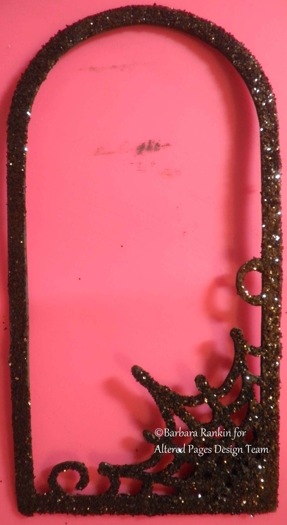 Apply a coat of glue to the web frame and add black soot distress glitter. Allow to dry.