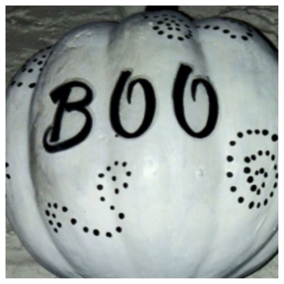 Apply a coat of Mod Podge to the pumpkin, lay the letters on and let dry before adding another layer to seal.