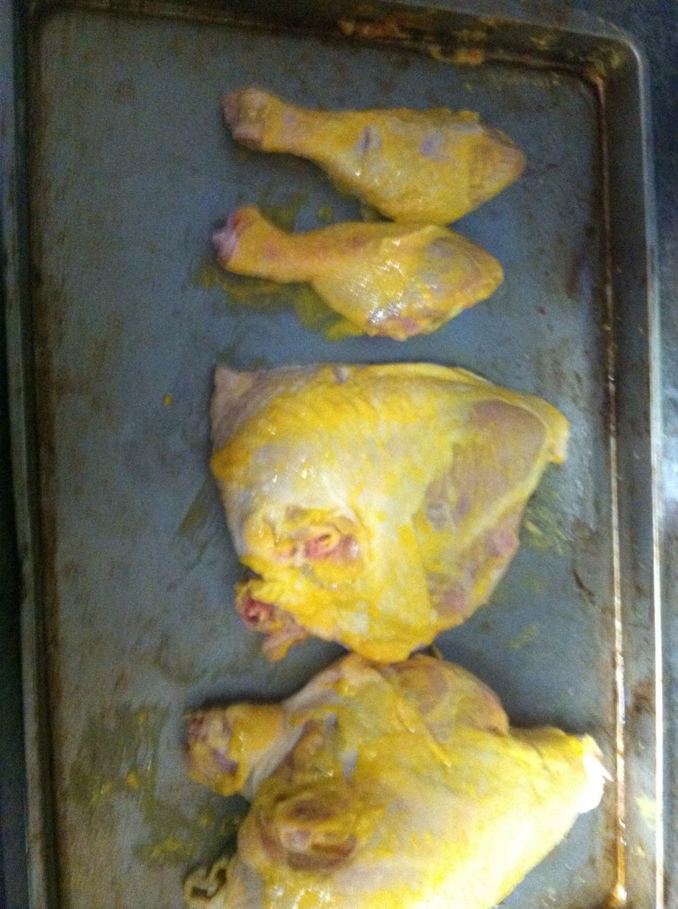 Apply a coat of yellow mustard to both sides of the chicken quarters. This isn't for flavor and you won't taste it when it's finished cooking. It's told hold the rub on to the chicken.