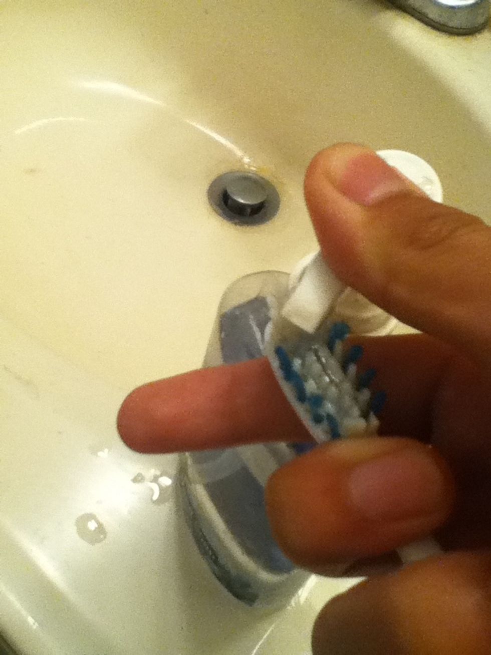 Apply a dab a soap to your old toothbrush.