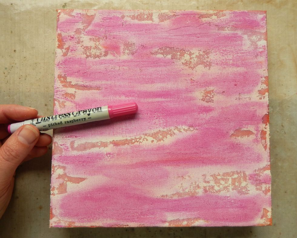 Apply a generous amount of Picked Raspberry Distress Crayon to the Texture Paste covered areas of the background and blend out with your finger.