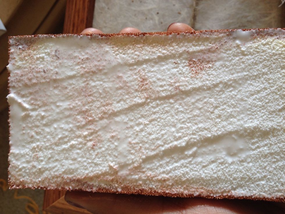 Apply a generous amount of wood glue to the unpainted back side