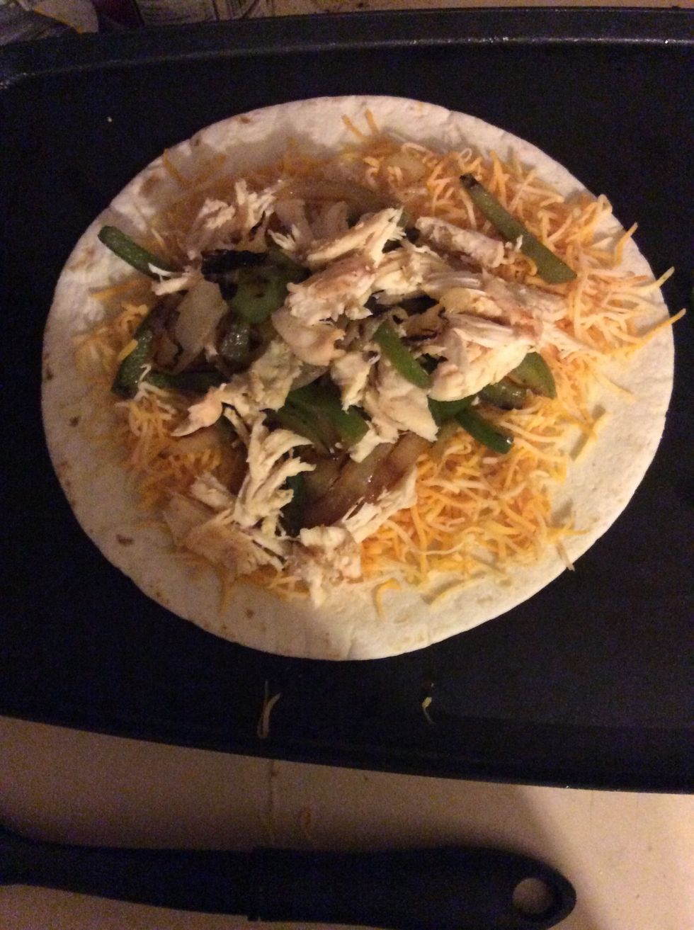 Apply a layer of cheese, then peppers and chicken