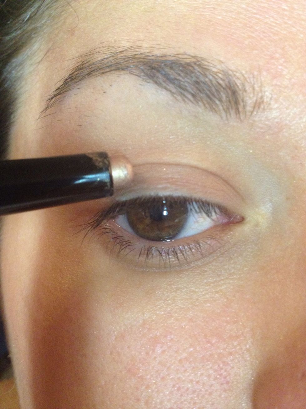 Apply a light colored cream shadow