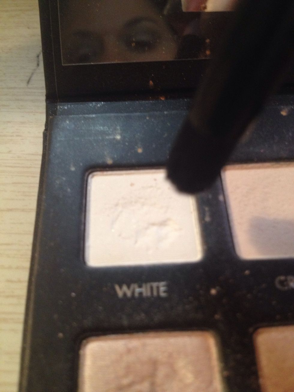 Apply a light matte shade to highest point of brow arch