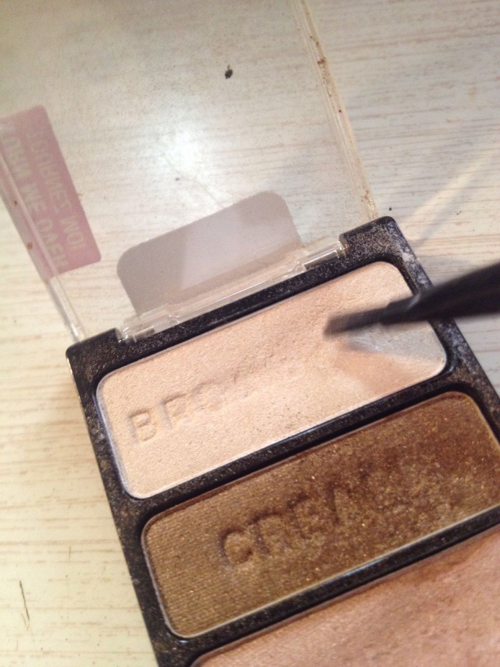 Apply a light shimmery shade to highest point of browbone and inner tear duct corner of the eyes.