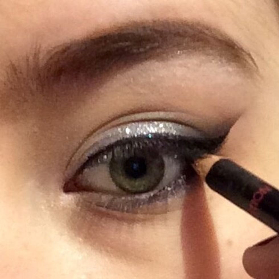 Apply a little kohl pencil to the outer lower waterline...