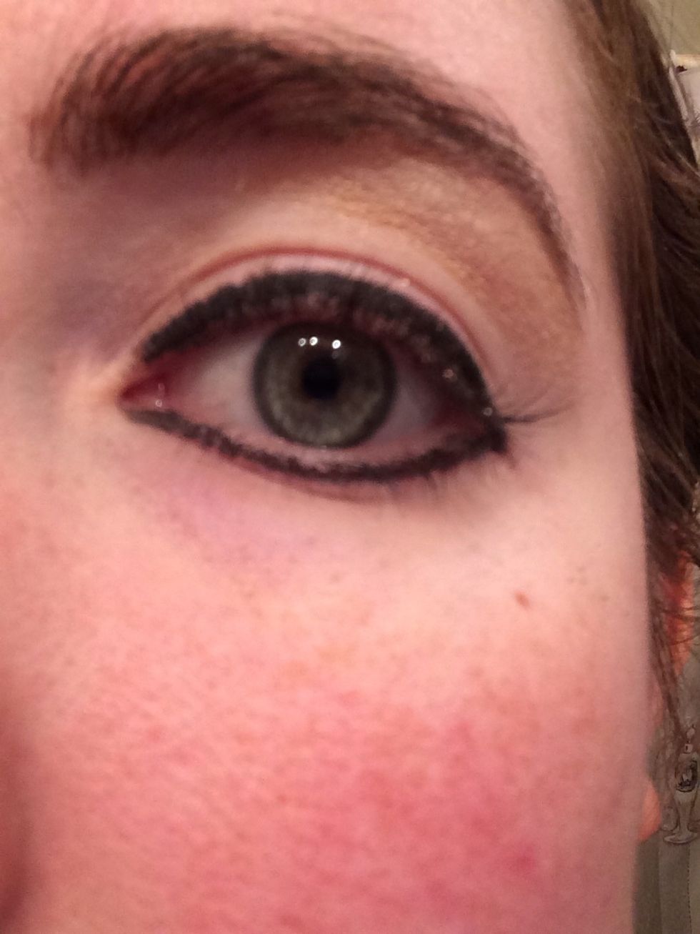 Apply a neutral color to the arch of your brow bone and toward the end of the brow.