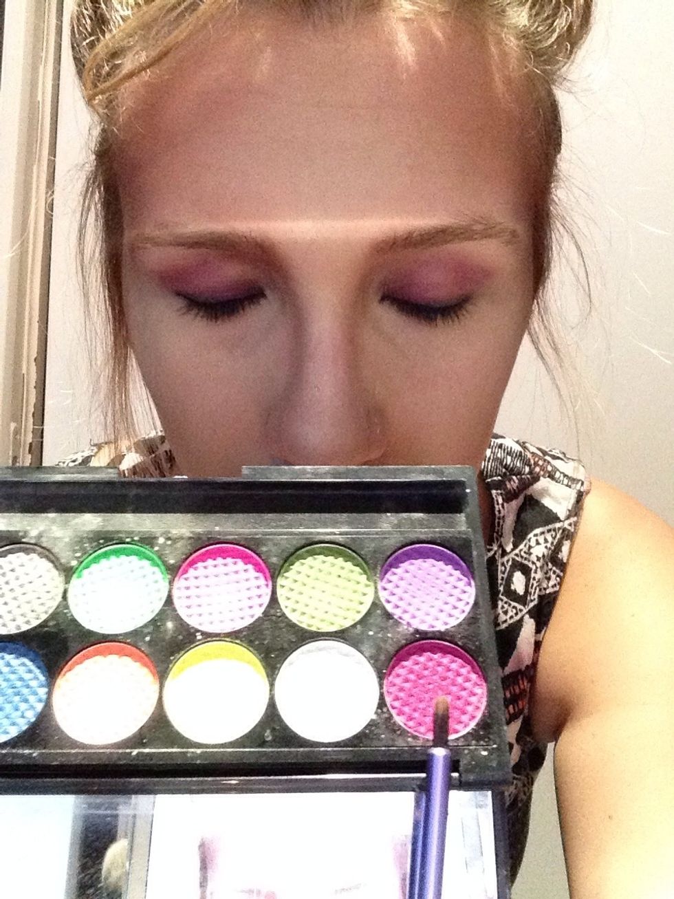 Apply a pink/ purple eyeshadow on your entire lid and blend it.