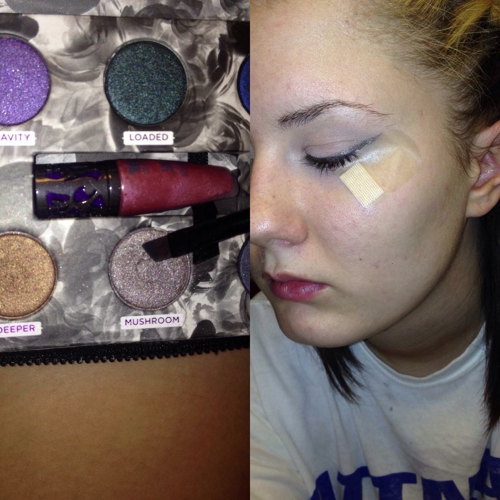 Apply a shimmer grey in the outer corner making a "wing"