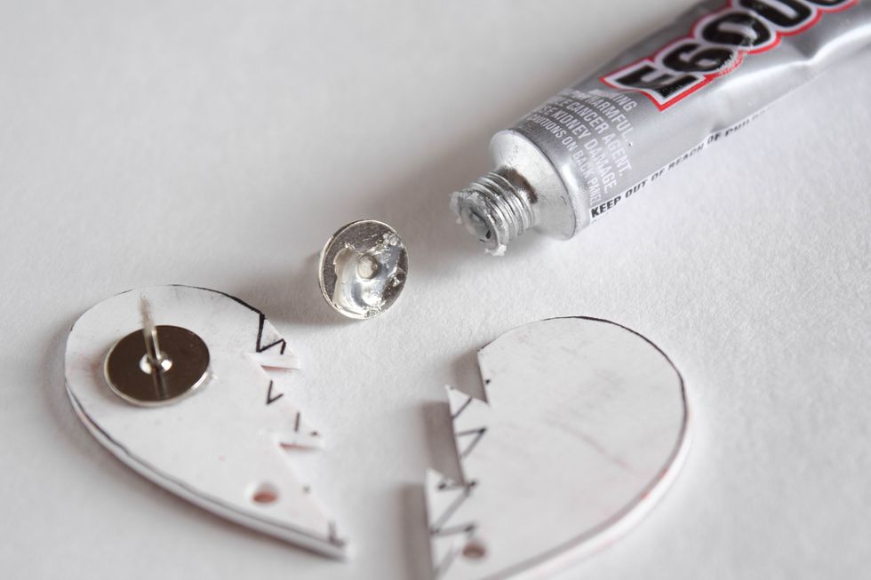 Apply a small amount of E6000 to the back of a pin.