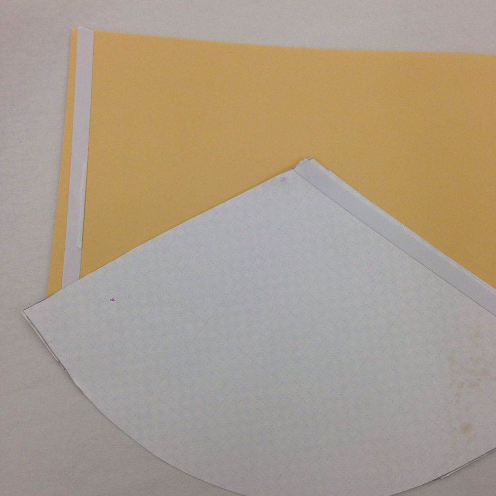 Apply a strip of double stick tape along one edge of the roof. Apply another strip of double stick tape along one edge of the house. Leave the pieces flat for now.