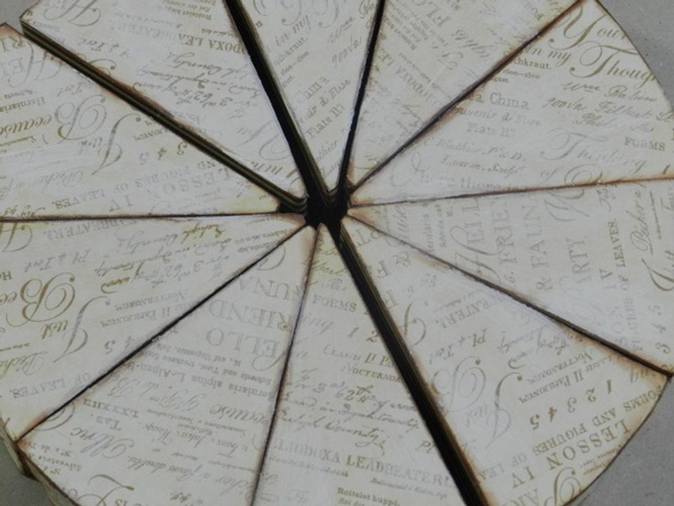 Apply a thin layer of Acrylic Gesso  on top of the cake and remove the excess with a baby wipes.